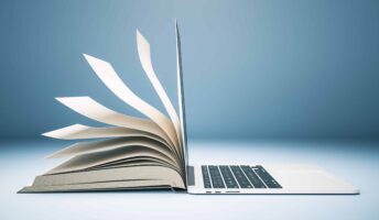 laptop with book