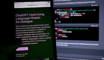 ChatGPT on a phone screen in front of code