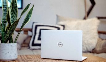 dell xps laptop on coffee table