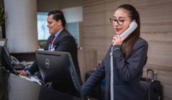hotel receptionist on phone