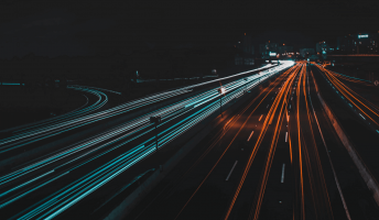 vehicles along freeway at night light painting